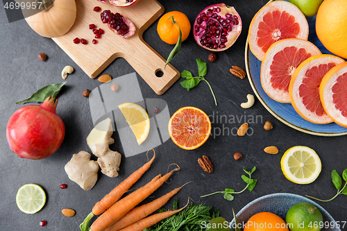 Image of different vegetables and fruits on on slate table