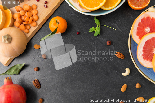 Image of different vegetables and fruits on on slate table