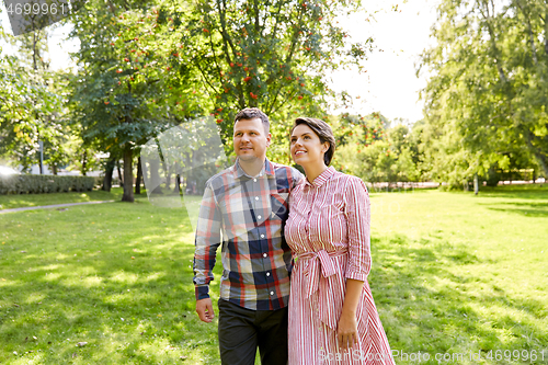 Image of happy couple in summer park