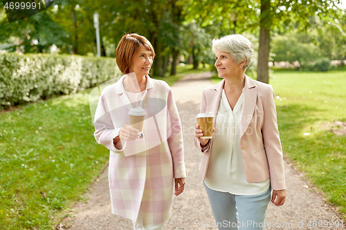 Image of senior women or friends drinking coffee at park