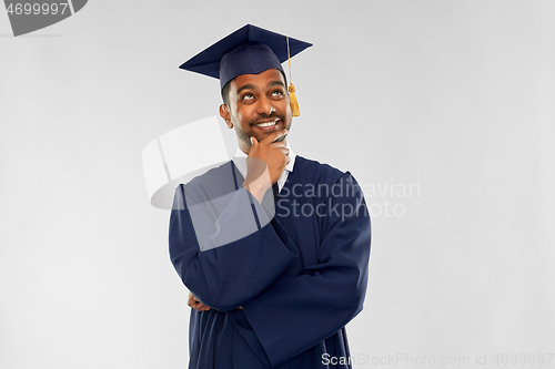 Image of indian graduate student in mortar board thinking