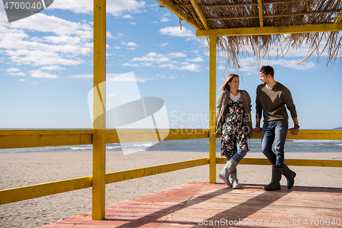 Image of Couple chating and having fun at beach bar