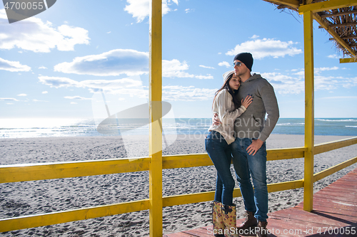 Image of Couple chating and having fun at beach bar