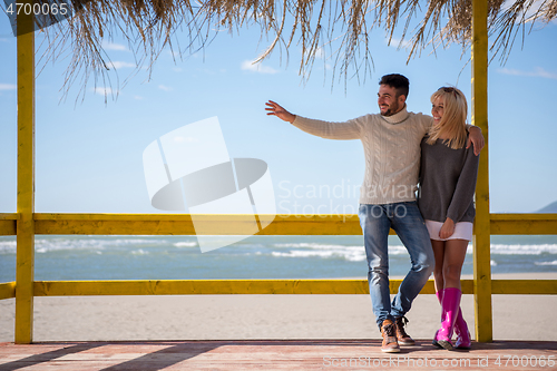 Image of Couple chating and having fun at beach bar