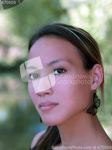 Image of Young asian american woman outdoor portrait leaves