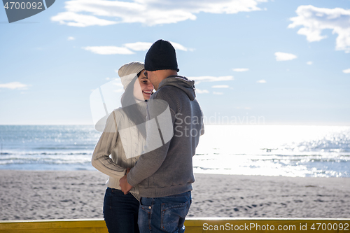 Image of Couple chating and having fun at beach bar