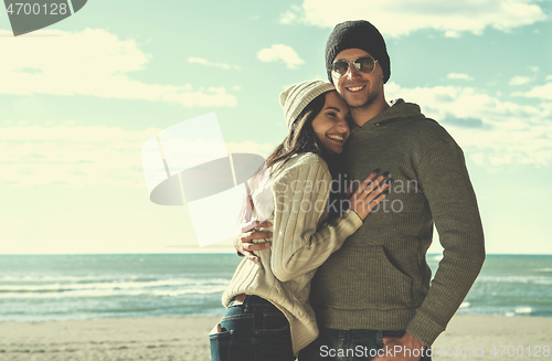 Image of Couple chating and having fun at beach bar