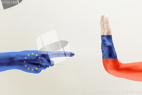 Image of Hand colored in flags of EU and Russia