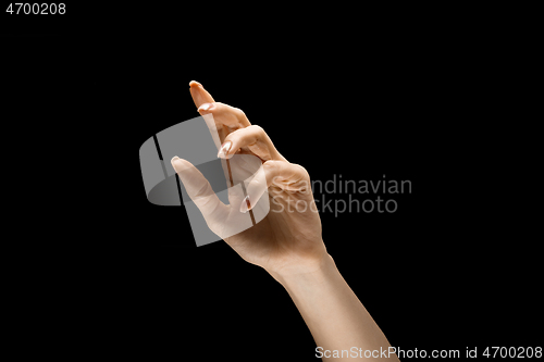 Image of Female hand demonstrating a gesture of getting touch isolated on gray background