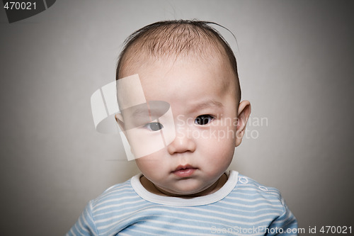 Image of Asian baby staring