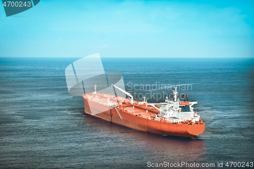 Image of Red oil tanker or cargo ship on the sea