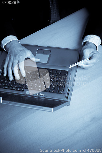 Image of Senior businessman shopping online