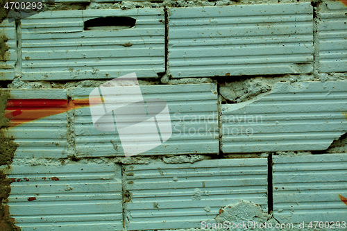 Image of Old broken bricks with striated surface pattern