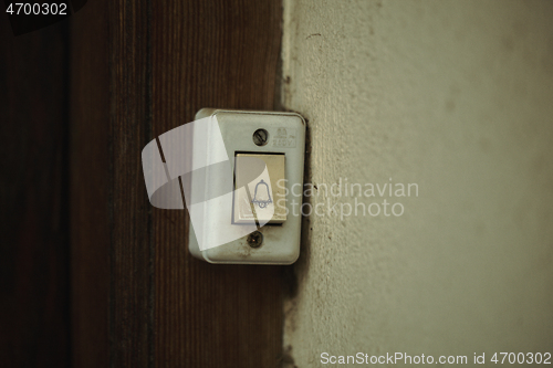 Image of Close up on a filthy old electric doorbell fitting