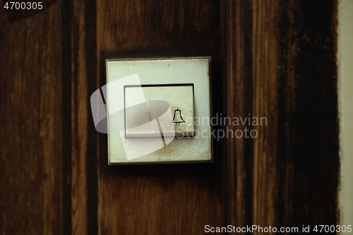 Image of Close up on a filthy old electric doorbell fitting