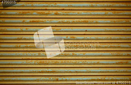 Image of Old rusting metal security shutters texture