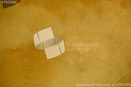 Image of Weathered stained ochre wall background texture