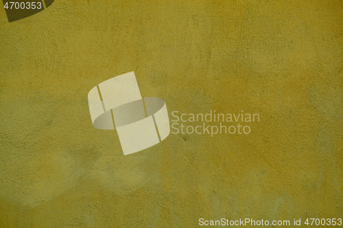 Image of Dingy dark ochre painted wall background texture