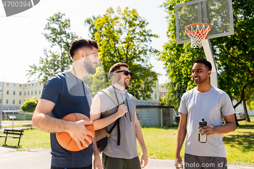 Image of group of male friends going to play basketball