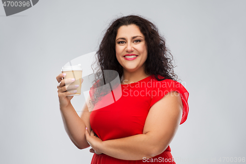 Image of woman in red dress holding takeaway coffee cup