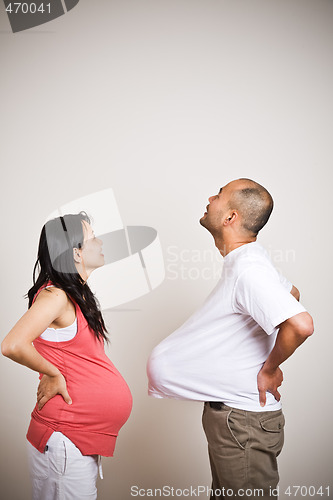 Image of Happy expecting pregnant asian couple