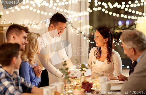 Image of happy family having birthday party at home