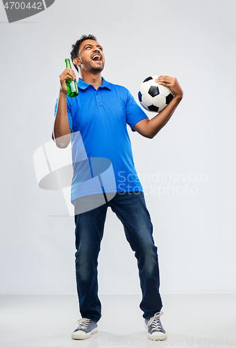 Image of football fan with soccer ball celebrating victory