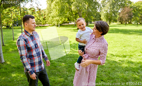 Image of happy family at summer park