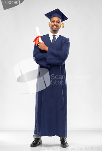 Image of male graduate student in mortar board with diploma