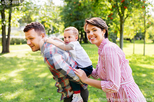 Image of happy family having fun at summer park