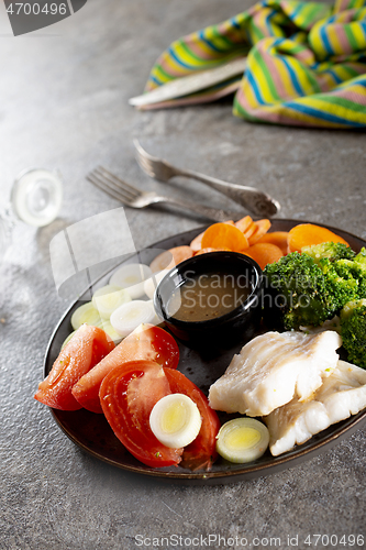 Image of fish with vegetables