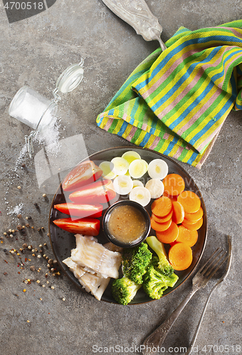 Image of fish with vegetables