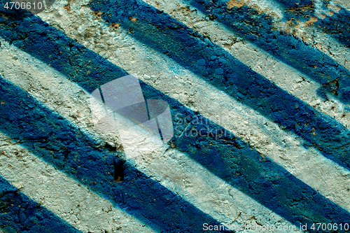 Image of Wall painted with blue and white chevron stripes