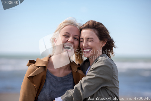 Image of Women Smiling And Enjoying Life at Beach