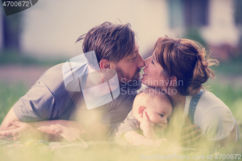 Image of hipster family relaxing in park