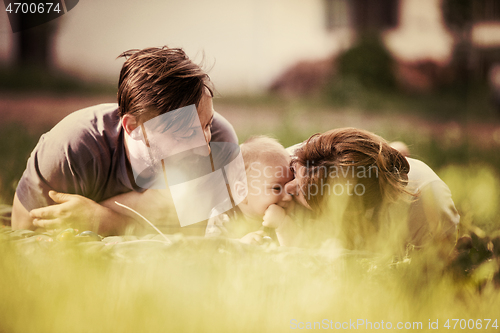 Image of hipster family relaxing in park