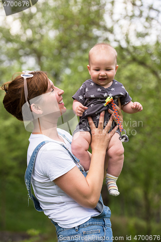 Image of woman with baby  in nature