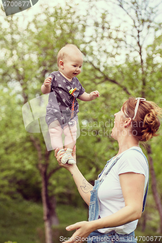 Image of woman with baby  in nature