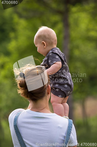 Image of woman with baby  in nature