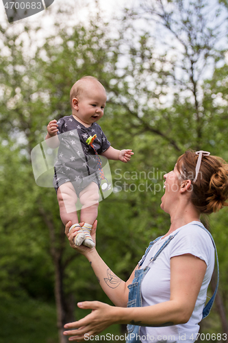 Image of woman with baby  in nature