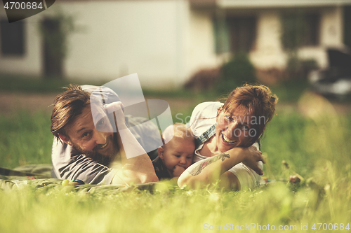 Image of hipster family relaxing in park