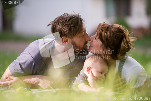 Image of hipster family relaxing in park