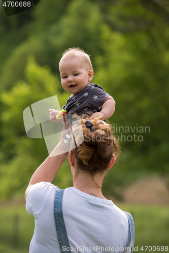 Image of woman with baby  in nature