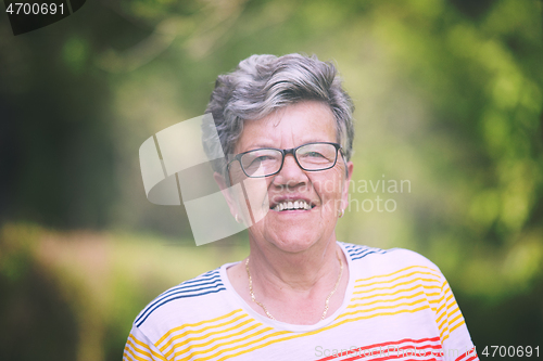 Image of happy  senior woman with eyeglasses