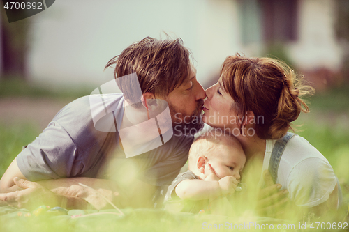 Image of hipster family relaxing in park