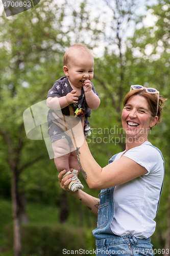 Image of woman with baby  in nature