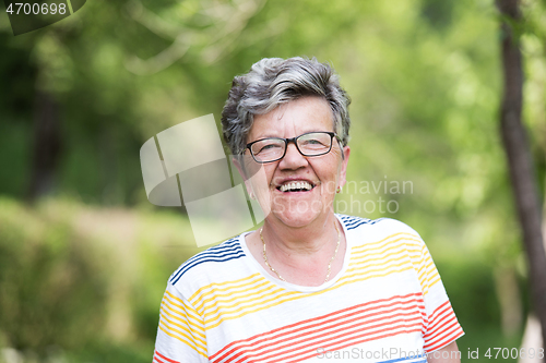 Image of happy  senior woman with eyeglasses
