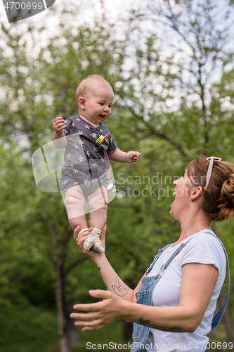 Image of woman with baby  in nature