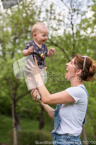 Image of woman with baby  in nature
