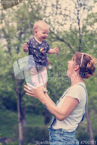 Image of woman with baby  in nature